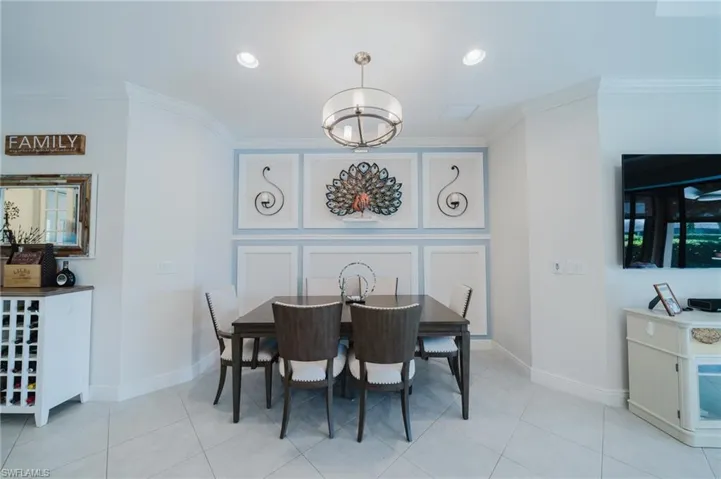Dining area featuring ornamental molding, recessed lighting, and light tile patterned flooring