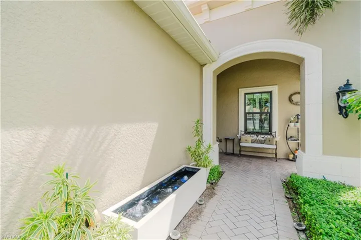 Doorway to property with stucco siding