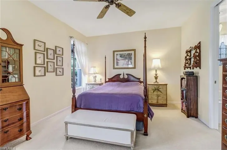 Carpeted bedroom with ceiling fan
