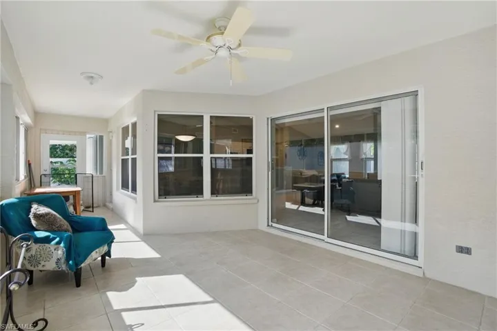 Sunroom with a ceiling fan