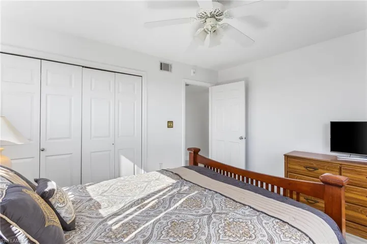 The corner "extra" bedroom (only the end units have this third one) has large windows on two sides, space for a large bedroom set (queen shown), and a double closet.