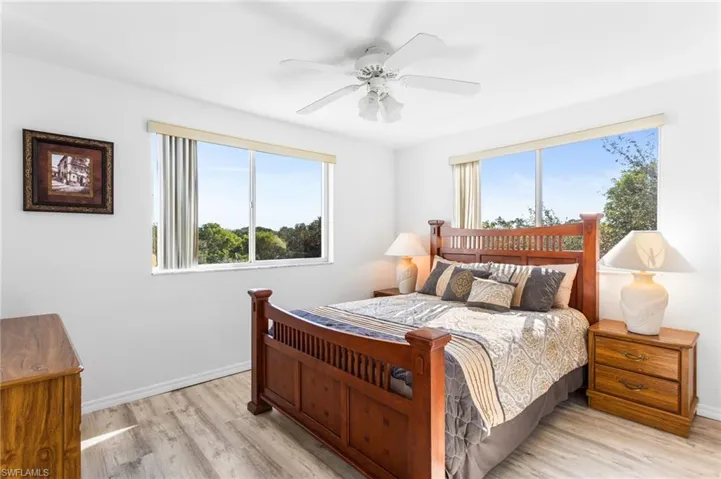 The corner "extra" bedroom (only the end units have this third one) has large windows on two sides, space for a large bedroom set (queen shown), and a double closet.