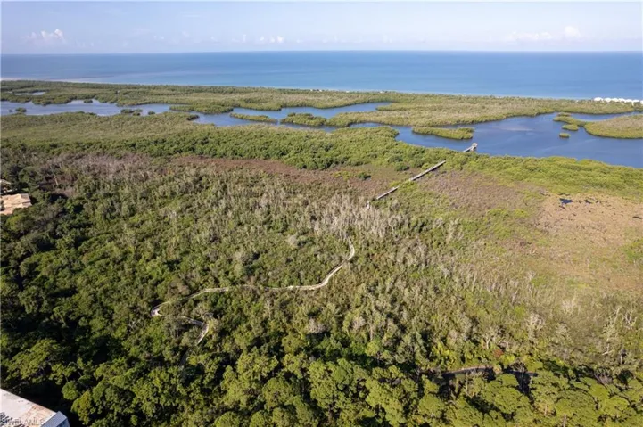 The walking paths lead to a boardwalk that extends through a natural preserve into the back bay