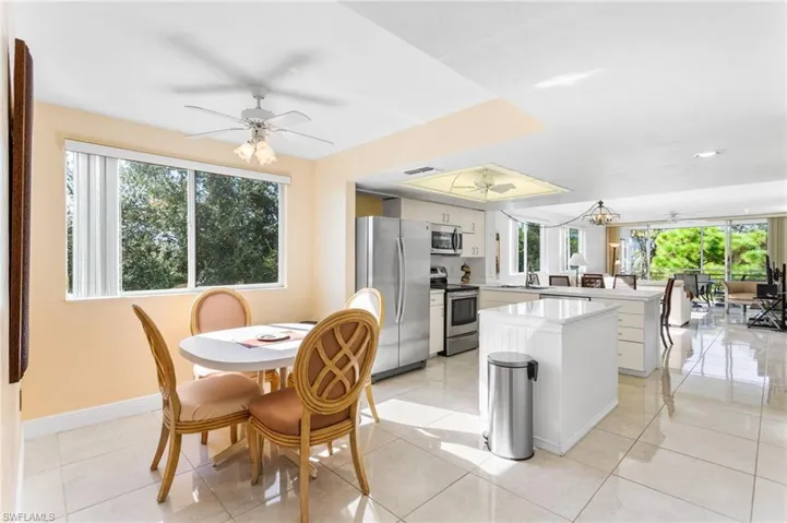 From the entry, relish the openness and brightness of the space, with south windows, light cabinetry and bright ceramic tile floors.