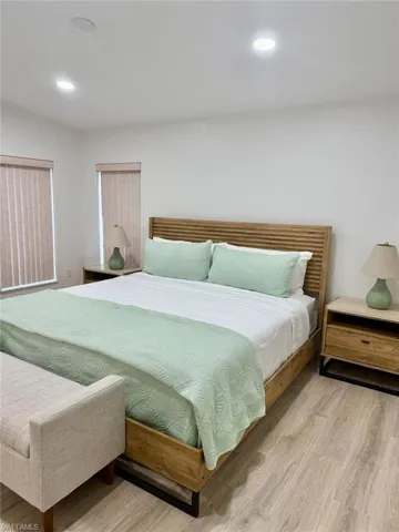 Bedroom featuring laminate finished floors and recessed lighting