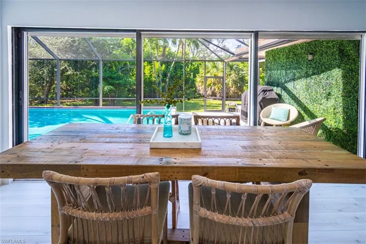Dining room with plenty of natural light and wood finished floors