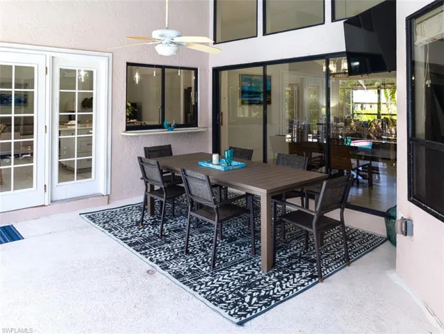 View of patio featuring a ceiling fan
