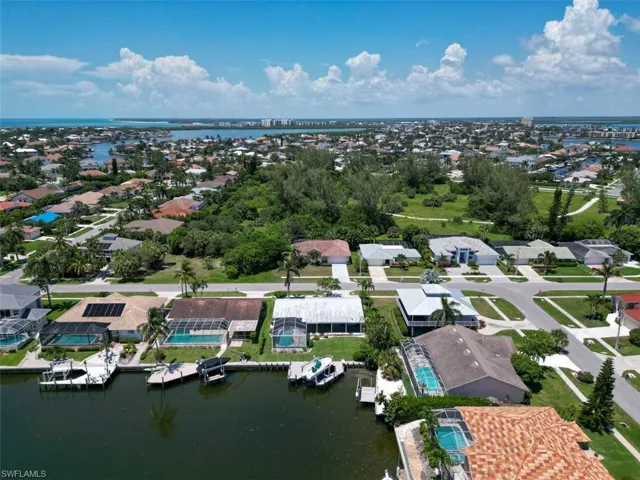 Aerial view of residential area with a nearby body of water