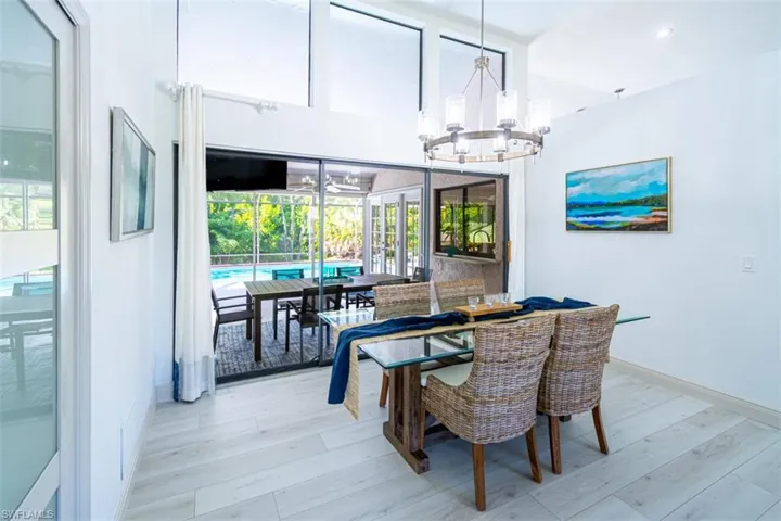 Dining space with a chandelier and wood finished floors