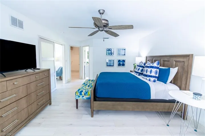 Bedroom with light wood-style flooring and ceiling fan