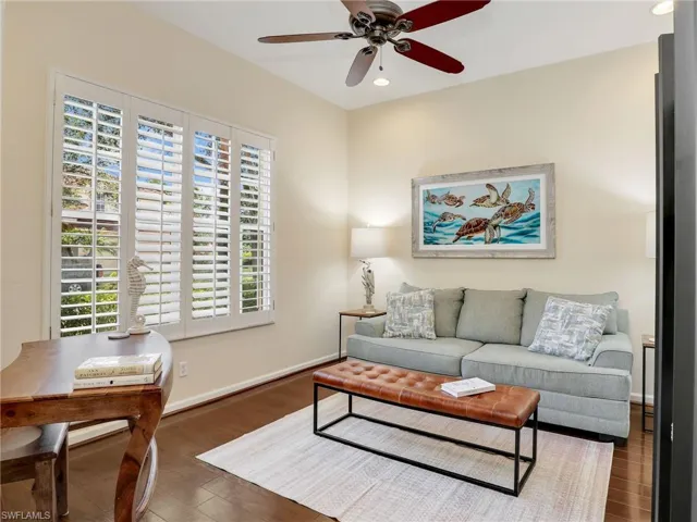 Living room featuring wood finished floors, ceiling fan, recessed lighting, and baseboards
