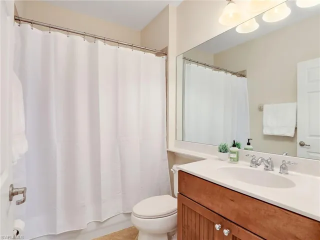 Full bathroom with vanity and toilet