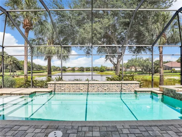 Outdoor pool featuring long water views