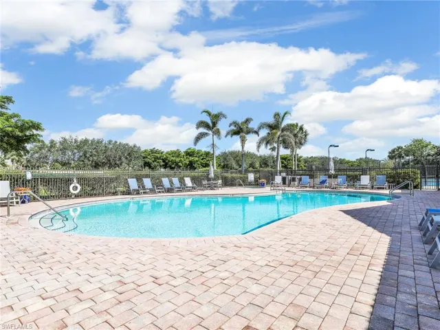 Community pool with a patio area