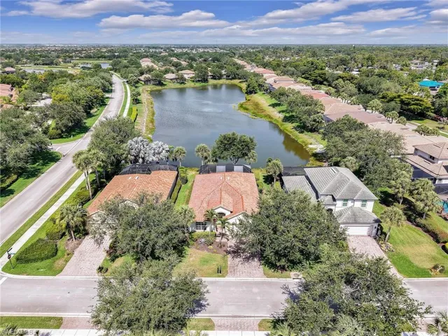 Aerial perspective of suburban area with a large body of water