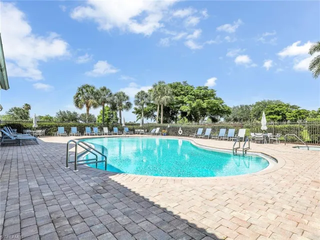 Community pool featuring a patio area