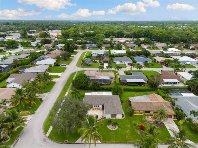 Aerial view of property's location featuring nearby suburban area