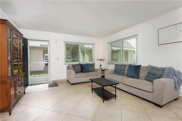 Living area featuring light tile patterned flooring