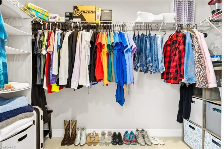 View of spacious primary closet