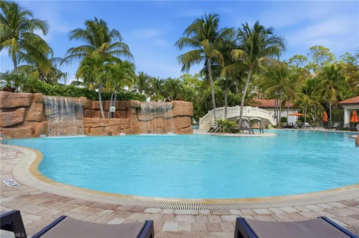 Community pool with a patio area and a gazebo