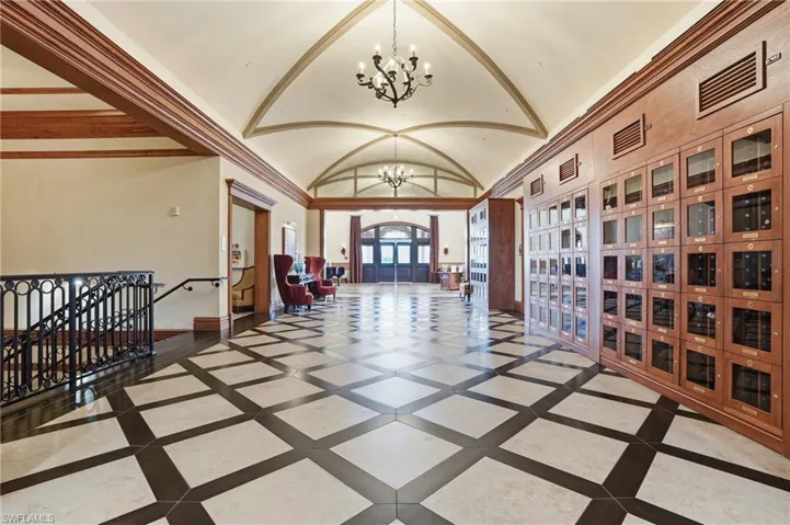 Lobby with lofted ceiling and crown molding