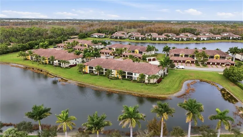 Aerial perspective of suburban area with a large body of water