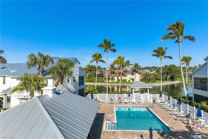 View of pool featuring a gazebo, a water view, and a patio area