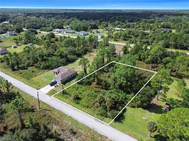 View of property location with property boundaries highlighted and a forest