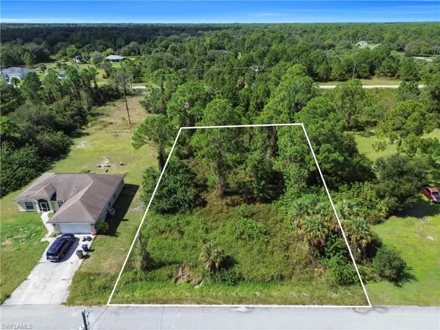 View of property location featuring a forest and property parcel outlined