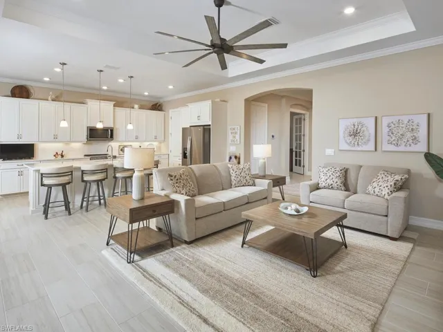Enjoy entertaining in the large great room, with access to your outdoor living area only steps away via hurricane impact sliding glass doors.
