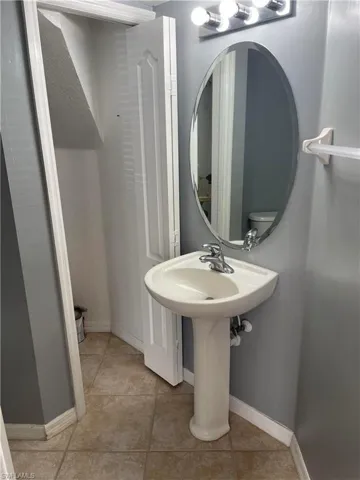 Bathroom featuring toilet and tile patterned floors