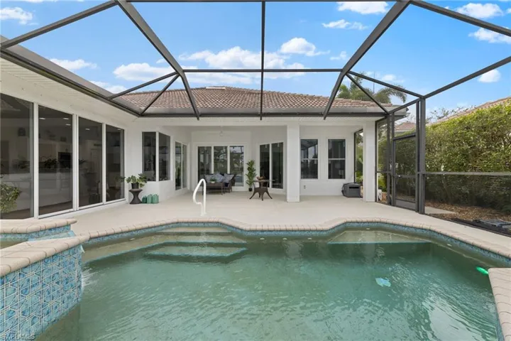 Just surfaced Pool and spa, lanai screen enclosure, and a large covered patio area