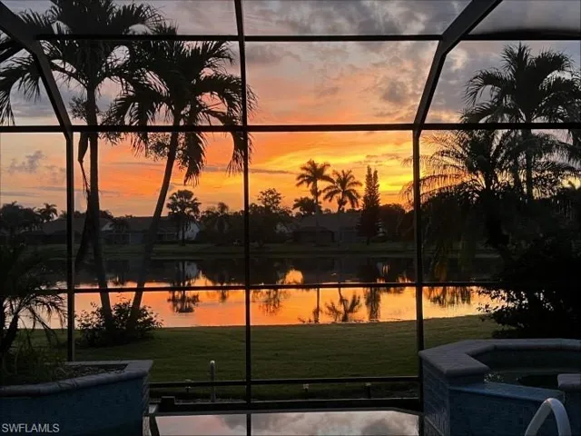 Property view of the sunrise over the lake.