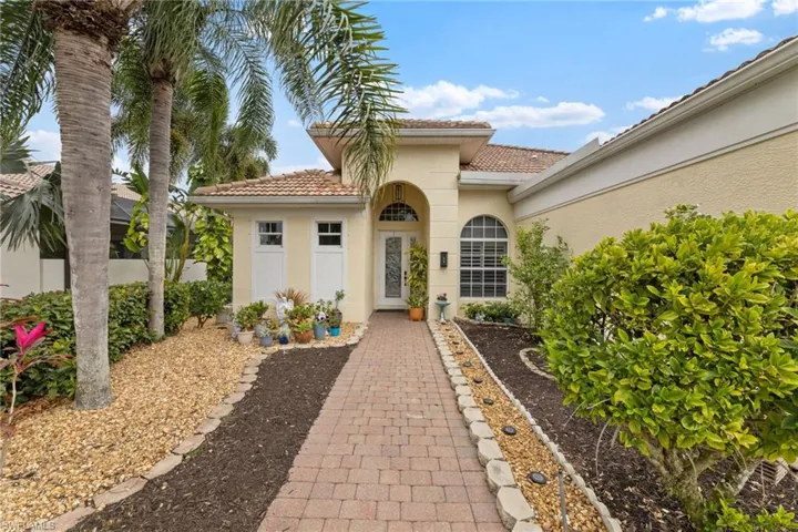 Property entrance featuring landscape lighting