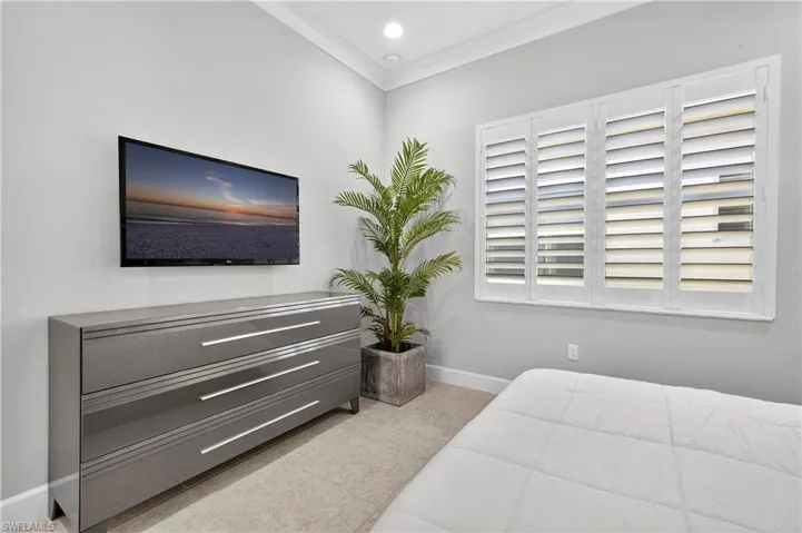 Bedroom featuring ornamental molding and recessed lighting