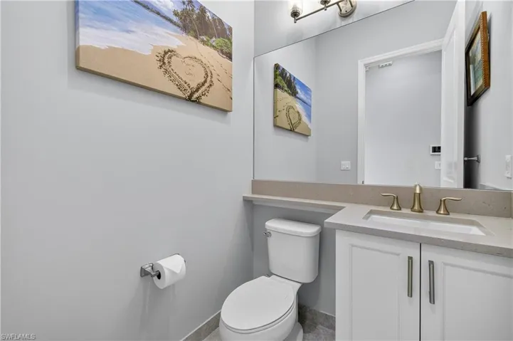 Half bath with vanity and toilet