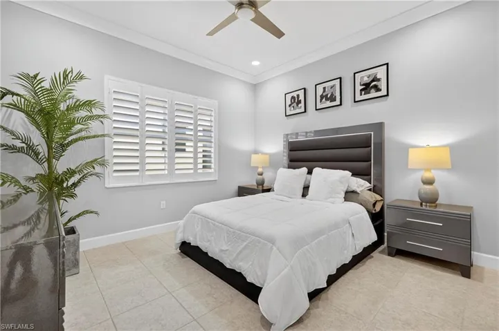 Bedroom featuring ornamental molding, light tile patterned floors, ceiling fan, and recessed lighting