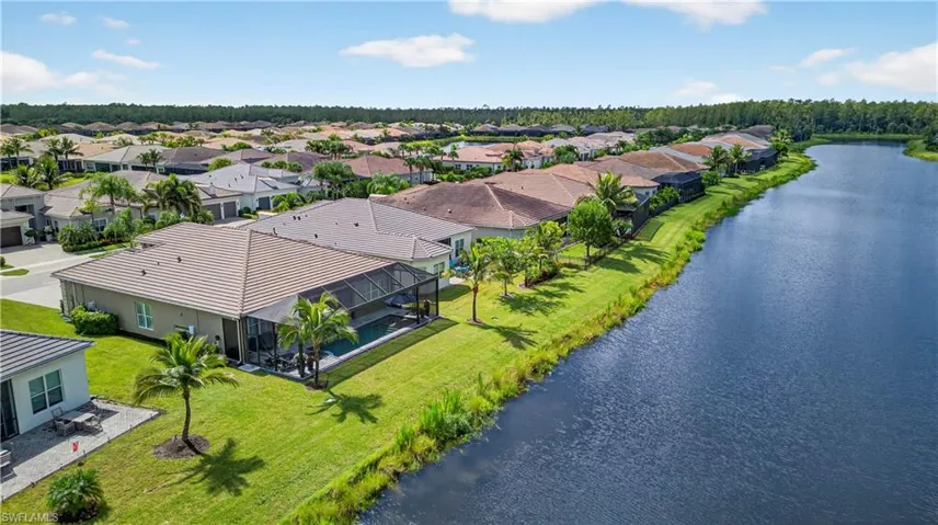 Aerial perspective of suburban area with a large body of water