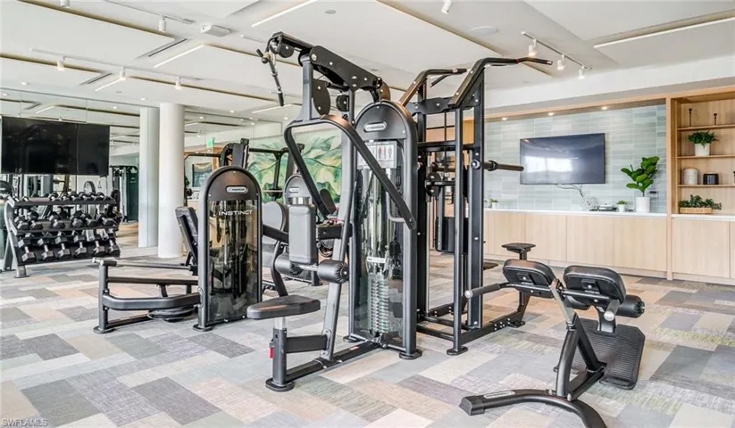 Exercise room with light carpet