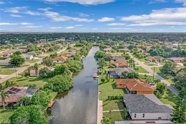 Aerial view of residential area with a large body of water