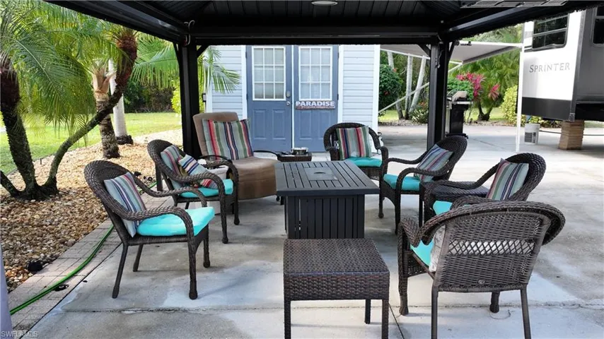 View of patio / terrace with a gazebo, grilling area, and outdoor lounge area