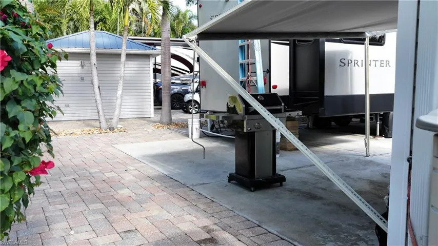 View of patio with an outbuilding