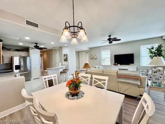 Dining room featuring visible vents, recessed lighting, a ceiling fan, and light wood finished floors