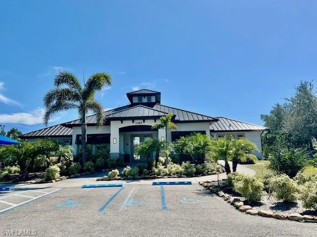 View of property with uncovered parking