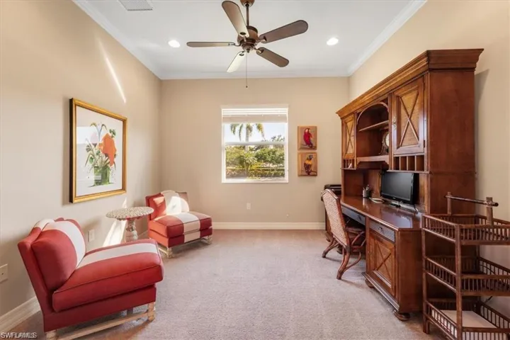 Home office with crown molding, light colored carpet, a ceiling fan, and recessed lighting