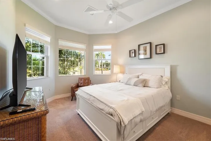 Bedroom with ornamental molding, carpet flooring, a ceiling fan, and recessed lighting