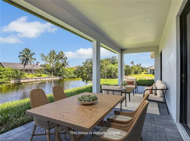 View of patio / terrace with a water view and outdoor dining space