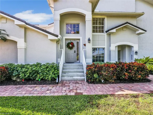 Property entrance featuring stucco siding