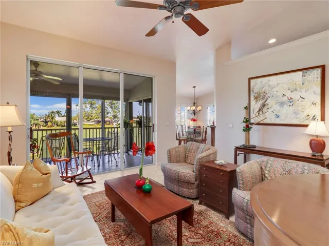 Flex space w/ lofted ceiling, a ceiling fan, and light tile patterned floors