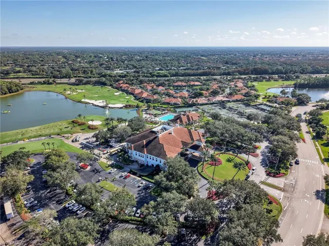 Drone / aerial view of a large body of water and a golf course